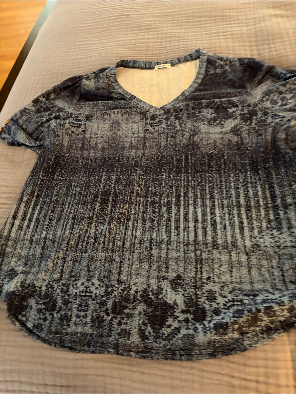 V neck blue patterned shirt with buttons on sleeves